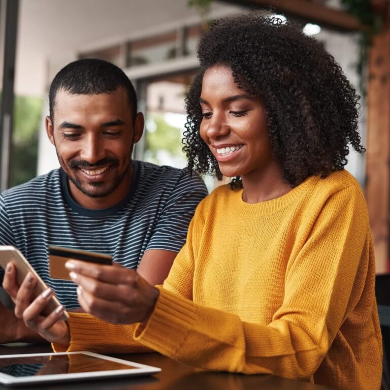 Woman and man looking at computer