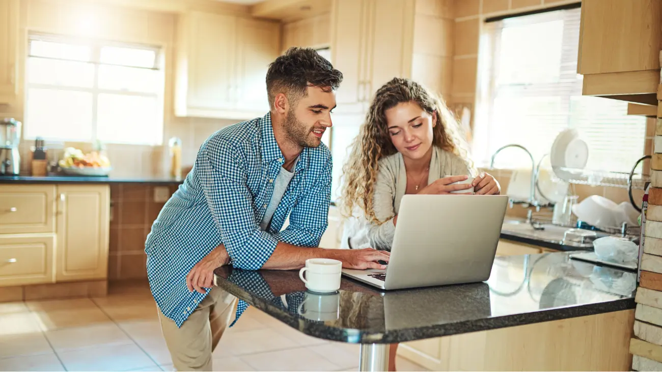 Couple using their computer for managing credit.